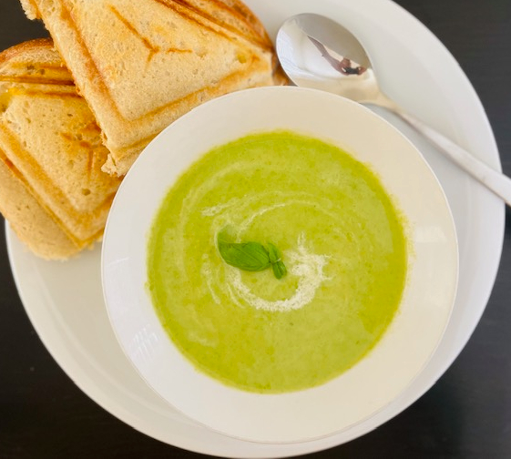 Pea soup served with a grilled cheese