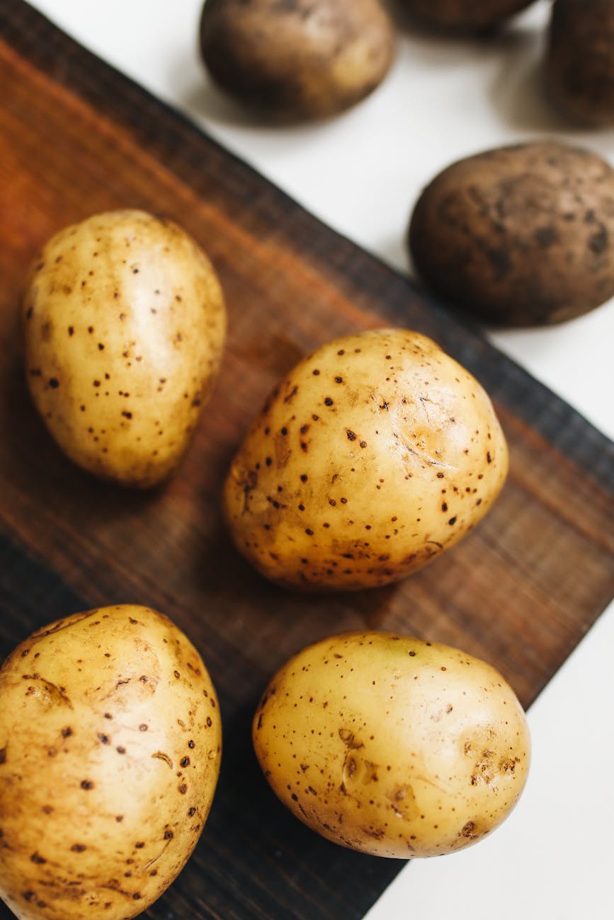 Potatoes on a cutting board.